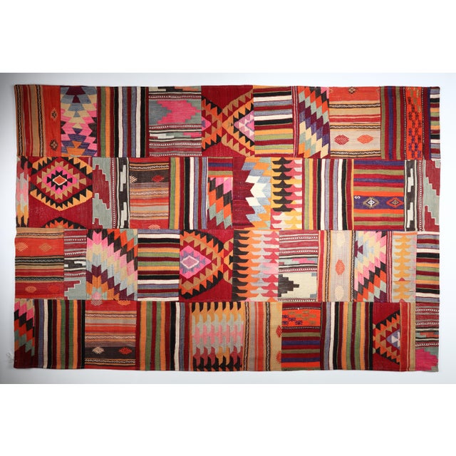 This striking patchwork kilim is handcrafted from authentic vintage Turkish Anatolian kilims, thoughtfully reassembled to...