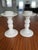 A beautiful and simple pair of vintage ceramic candleholders in white. Perfect for a summer spread.