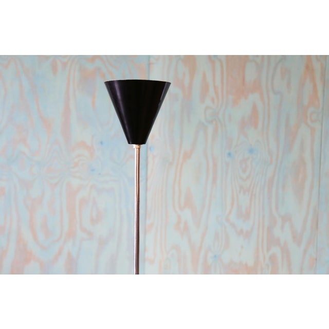 A 1960s floor lamp in chrome with a single black shade. Similar to David Wurster’s minimalist floor lamp for Raymor. The...