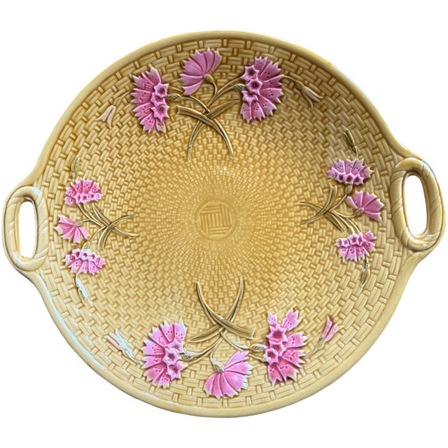 An antique German majolica serving platter by GS Zell, featuring raised pink carnations against a richly textured honey-...