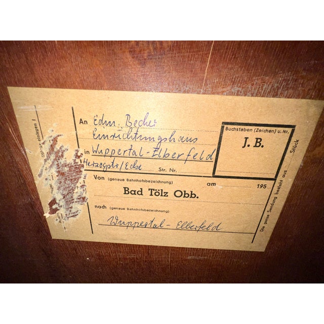 This Mid-Century extraordinary Deutsche Werkstätten Hellerau walnut highboard was delivered to a furniture store in...