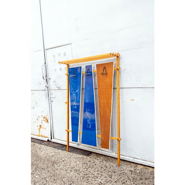 Coat hanger with wooden structure, Formica backdrop and iron details. Gio Ponti style Italian production 1950s This piece...