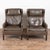 Pair of mid century Danish club chairs upholstered in chocolate brown vintage leather. Mid century modern in style, the...