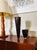 A striking coordinating pair of vintage black and gold art glass vases, attributed to the renowned Theresienthal...