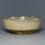 This antique Chinese shallow dish features soft yellow glaze with natural aged texture. A fine collectible ceramic piece...