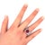 A captivating ruby, weighing 4.21 carats, is the focal point of this contemporary ring. The antique cushion-cut stone...