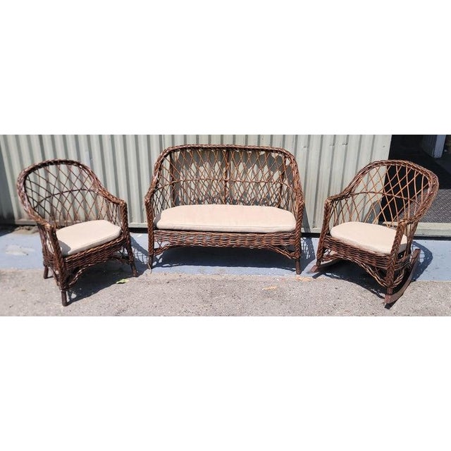 Haywood Wakerfield Wicker set of Four Children's chairs and Table Set in original surface. Insignia and stamp are show in...