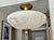 White alabaster flush mount ceiling light with aged patinated brass fittings in the Directoire style. Has lots of nice...
