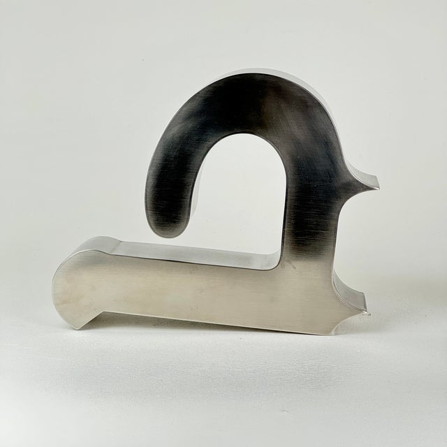 A vintage abstract form steel sculpture in the shape of a 'b' or 'd'. It's one of three we have in the store. Our main...