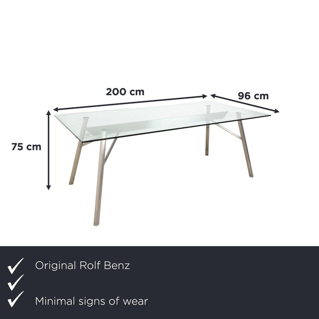This Rolf Benz glass table is an architectural statement that doesn't impose itself, but rather allows the room to...