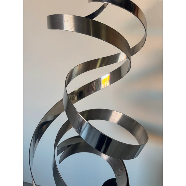 Striking and dynamic, this vintage 1986 “Ribbon” metal floor sculpture by Curtis Jere makes a bold artistic statement with...
