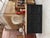 This antique cherry wood sideboard has been fully restored. It features a black patinated base with three functional...