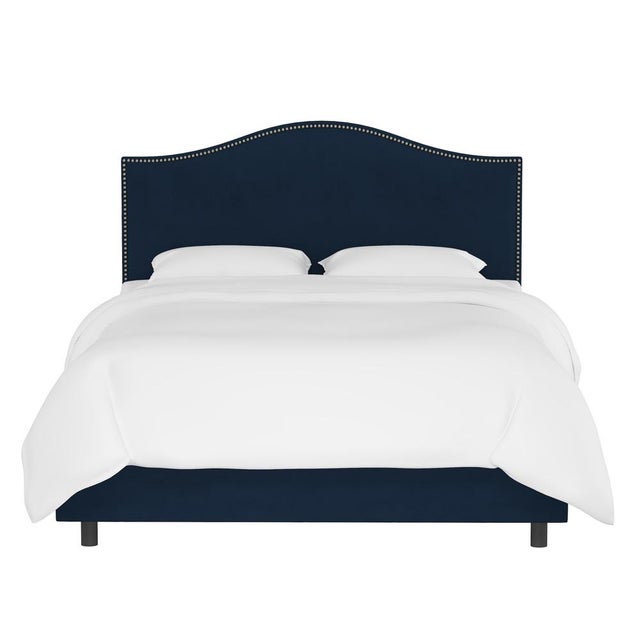 Give your interior a lift with the Bed. Featuring the delicate curves of a classic camelback design, with subtle nailhead...