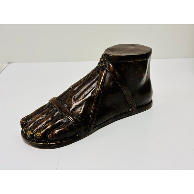 Beautifully detailed bronze reproduction of a foot from antiquity wearing a sandal. Reproductions of ancient Roman...