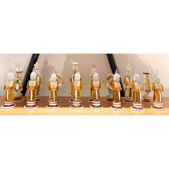 Rare Chess Set Composed of 32 Solid Amber Glass Pieces, finished in white or black pâte de verre, with gold leaf...