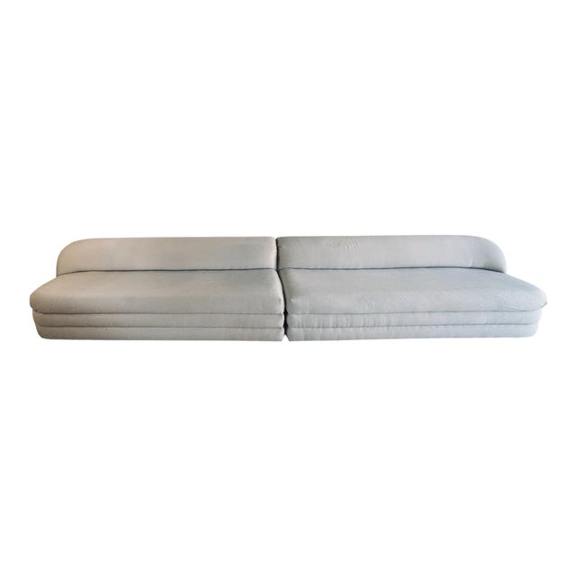 This is a two-piece extra long sofa, designed by Vladimir Kagan for Directional Furniture in the 1990s. The sofa was...