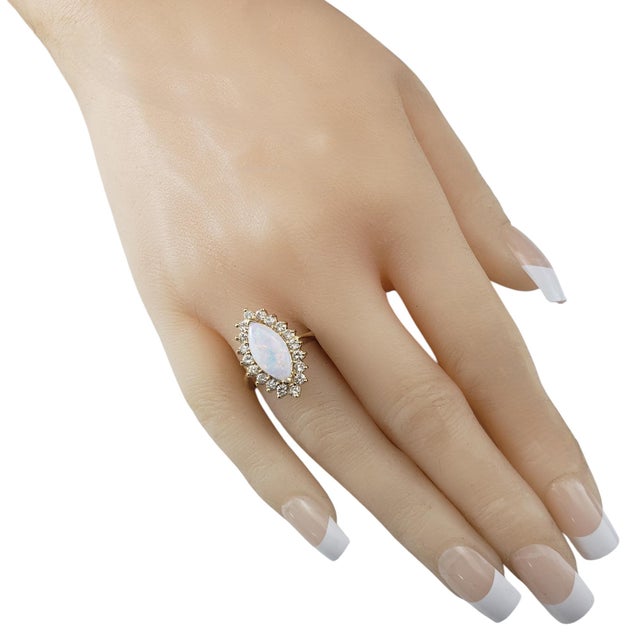 14 Karat Yellow Gold Opal and Diamond Ring Size 7.75 JAGi Certified- This stunning 14K yellow gold ring features one...