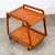 High quality rolling teak bar cart by Sika Mobler. Very fine details and construction. The piece sits casters and rolls...