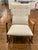 Solid walnut frame. Hidden counterweight provides a smooth, balanced feeling. Nine-button tufted back. Wear on the hind...