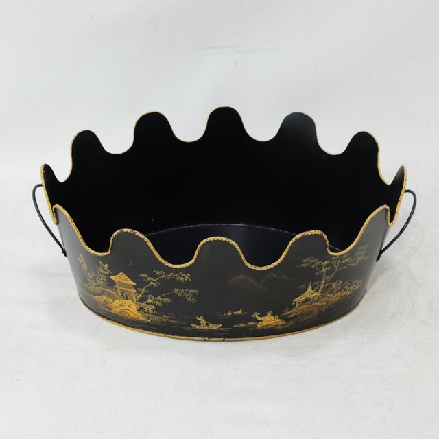 This exquisite vintage toleware planter features a classic oval silhouette with a dramatic, deep scalloped rim,...