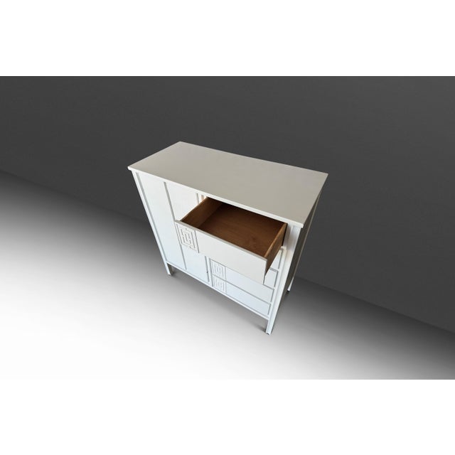 This sophisticated Mid-Century Modern gentleman’s dresser by Dixie, crafted in the USA during the 1960s, offers a perfect...