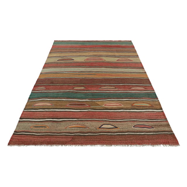 Made with handwoven wool in Azerbaijan circa 1940-1950, this 6x8 vintage Kilim is a particularly bright and sought-after...