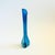 A mid century swung blown glass vase. Vibrant blue color to the glass with faint white striping. Measures 2.5"Dia x 10.5"H