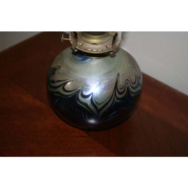 Lovely Artisan swirl design oil lamp. The hand blown lamp is signed -signature not recognized and dated "89". The dial is...