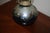 Lovely Artisan swirl design oil lamp. The hand blown lamp is signed -signature not recognized and dated "89". The dial is...