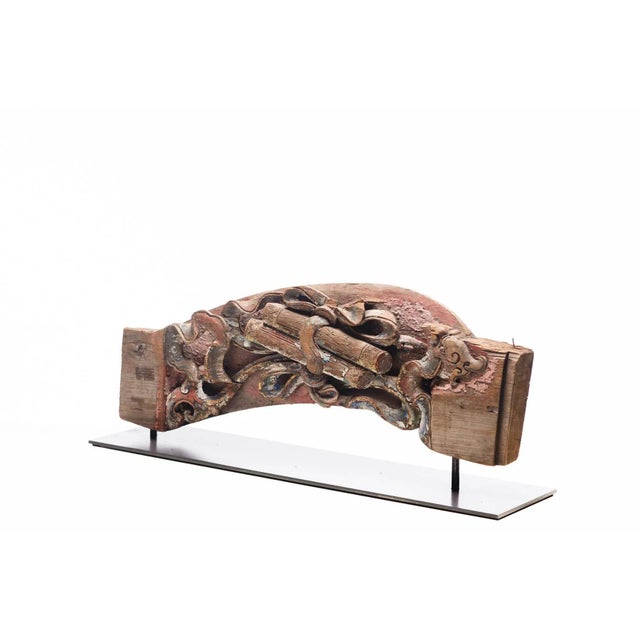 An antique Chinese temple fragment of a temple's strut featuring highly intricate carving and mounted on a custom made...