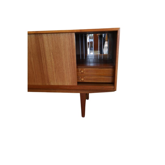 Long and stylish sideboard designed by E.W. Bach for Sejling Stolefabrik in Denmark. Despite its generous width, the...