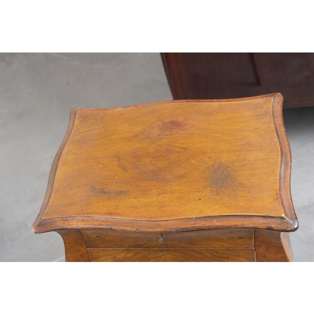 A charming French Provincial side table crafted in richly figured fruitwood, showcasing graceful cabriole legs and a...