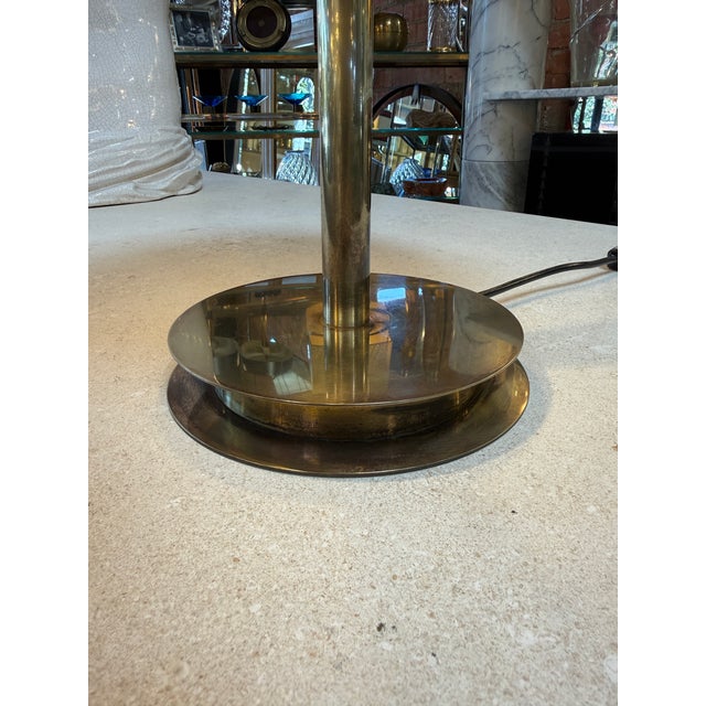 Iconic “Bis-Tris” table lamp by Fontana Arte, showcasing a refined Italian modernist design with its signature double-dome...