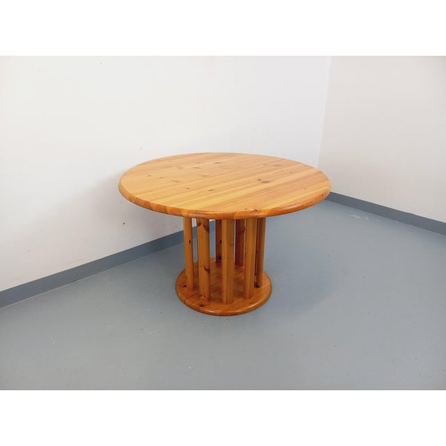 Vintage Scandinavian round table from the 1960s/70s, made of pine, in the style of Danish designer Rainer Daumiller for...