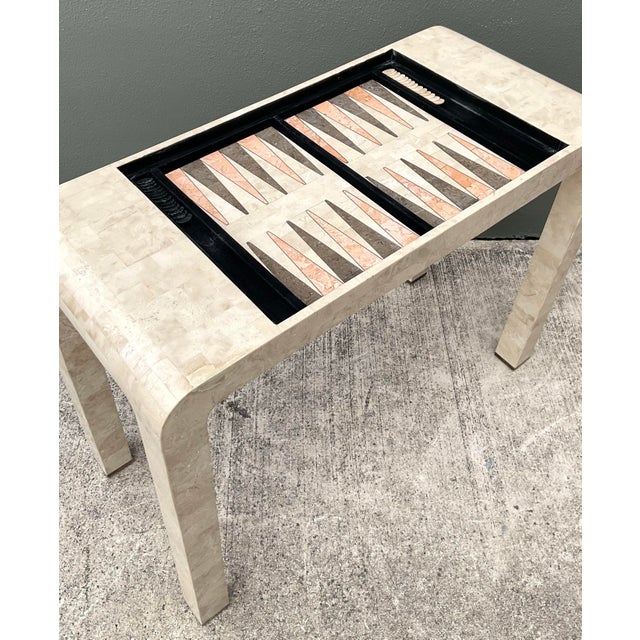 This striking postmodern game table is a masterclass in geometric form and artisanal craftsmanship. Exemplifying the...