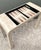 This striking postmodern game table is a masterclass in geometric form and artisanal craftsmanship. Exemplifying the...