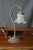 White Tulip Lamp. A delicate Art Nouveau lamp, the bronze base curves like a flower stem, minimalist with a hint of small...