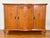 1950s Italian honey pine sideboard buffet. Features ample space for storage with three doors with applied fruit carvings...