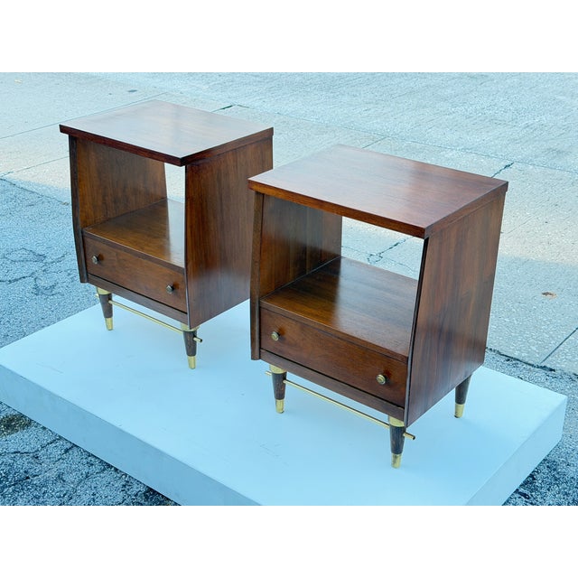 A pair of classic mid century nightstands attributed to National Furniture Co, USA, ca' 1960's Walnut with open back...