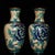 A beautiful pair of Chinese Cloisonné enamel vases. Each vase features a classic baluster shape with a flared rim and is...