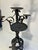 This hand forged iron candelabra features an elephant design on the base Each arm has incised designs hand done Nice patina