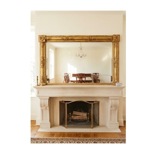 A highly attractive and well-proportioned regency giltwood overmantel mirror. This fine quality antique mirror features an...