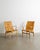 A rare and iconic pair of swedish mid century modern "eva" armchairs in form pressed birch wood and original woven leather...