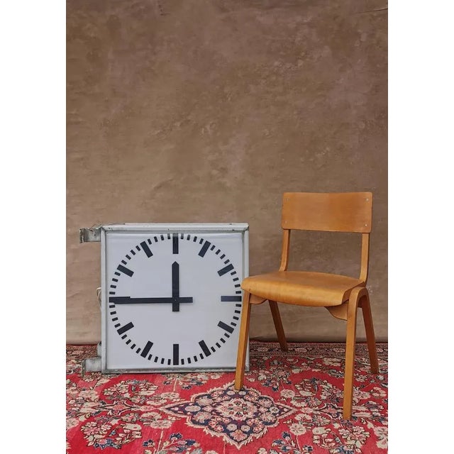 This large, illuminated clock of tn ("telephone engineering and normal time") with double-sided dial dates from the 1960s...