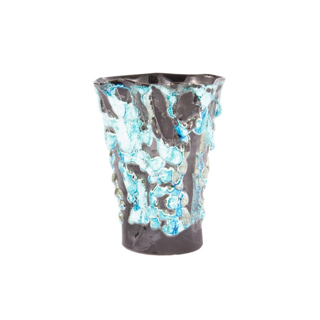 An Écume de Mer fat lava ceramic vase produced by Le Cyclope. Made in France, this mid-century vase features a tapered...