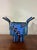 A striking handcrafted American studio ceramic vessel dating to the late 1980s or early 1990s, embracing the playful...