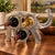 Unique decorative elephant wine bottle holder featuring a sculptural design with multiple openings for displaying wine...
