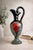 A highly expressive Italian mid-century ceramic ewer in the manner of Bitossi, showcasing a dramatic interplay of form,...