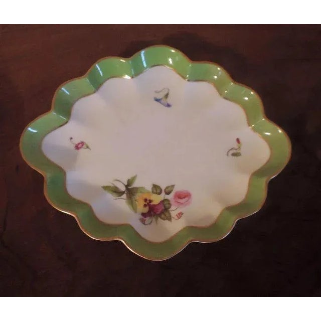 An exceptional 18th c. Derby cabinet plate of diamond shape with ruffled / scalloped rim highlighted in rich gilding....