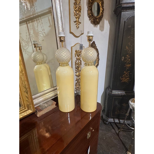 This product is a pair of large Murano cream cone form lamps. This pair features a unique and elegant design, adding a...